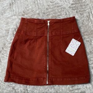 Rust-colored, zip-front Free People mini skirt